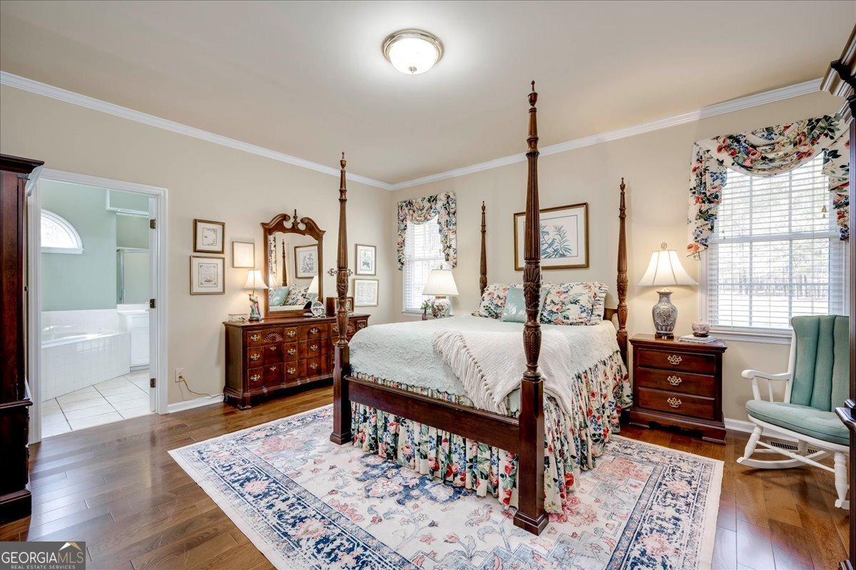 1490 Country Club Circle Wrens, GA 30833 - Photo 18 of 40 a living room with furniture a rug and a chandelier