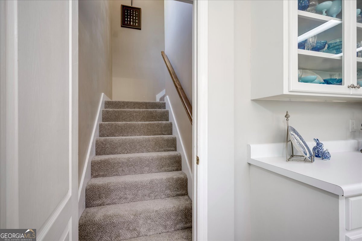 1490 Country Club Circle Wrens, GA 30833 - Photo 25 of 40 a view of staircase with white walls and a window