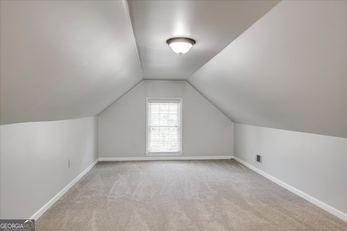 1490 Country Club Circle Wrens, GA 30833 - Photo 29 of 40 an empty room with a empty space and windows