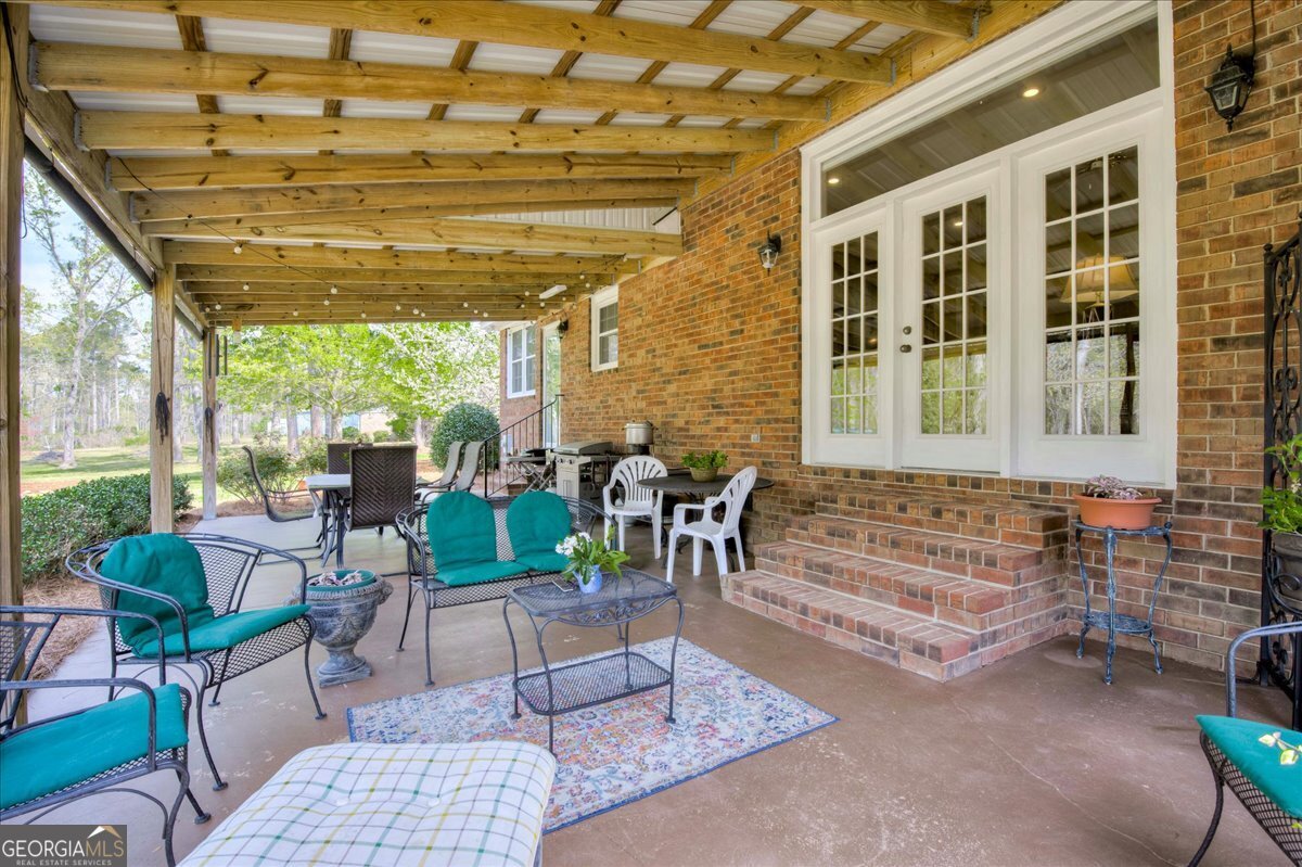 1490 Country Club Circle Wrens, GA 30833 - Photo 33 of 40 a outdoor living space with furniture