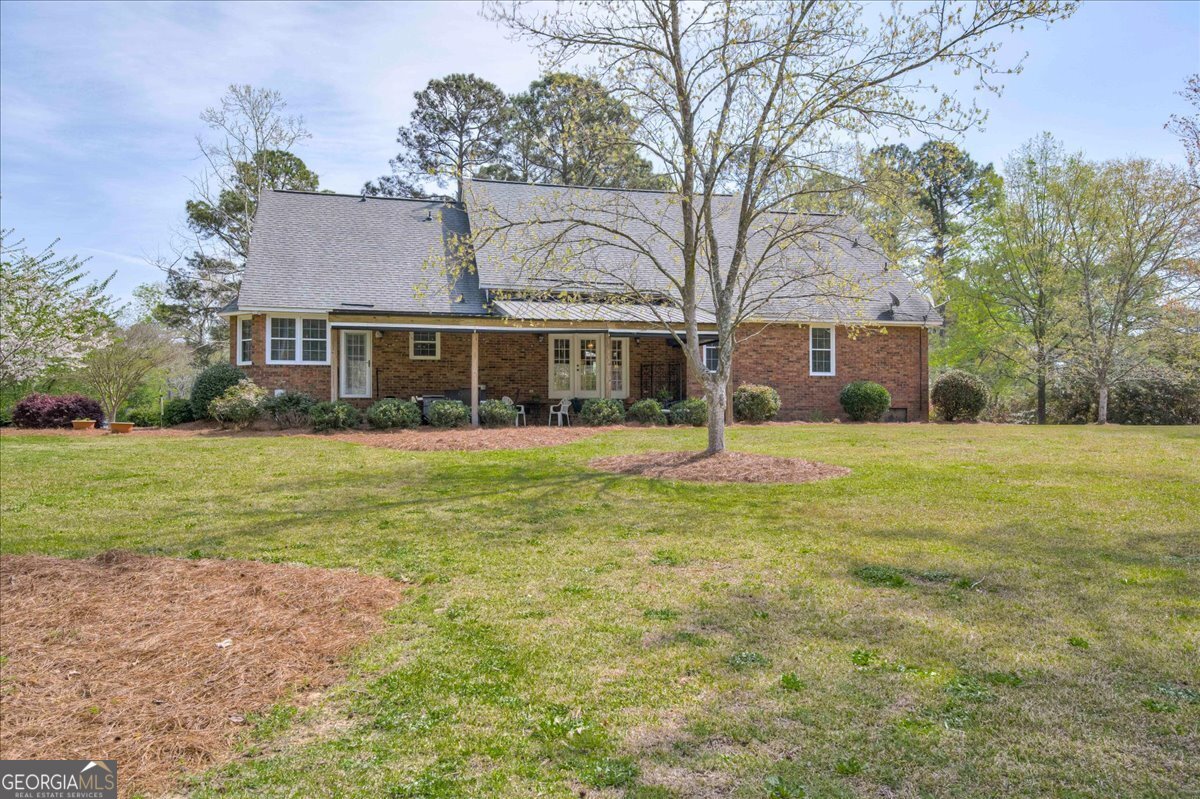 1490 Country Club Circle Wrens, GA 30833 - Photo 36 of 40 a front view of house with yard and green space