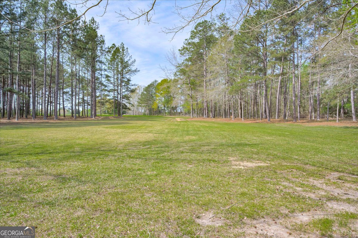 1490 Country Club Circle Wrens, GA 30833 - Photo 37 of 40 a view of outdoor space with trees all around
