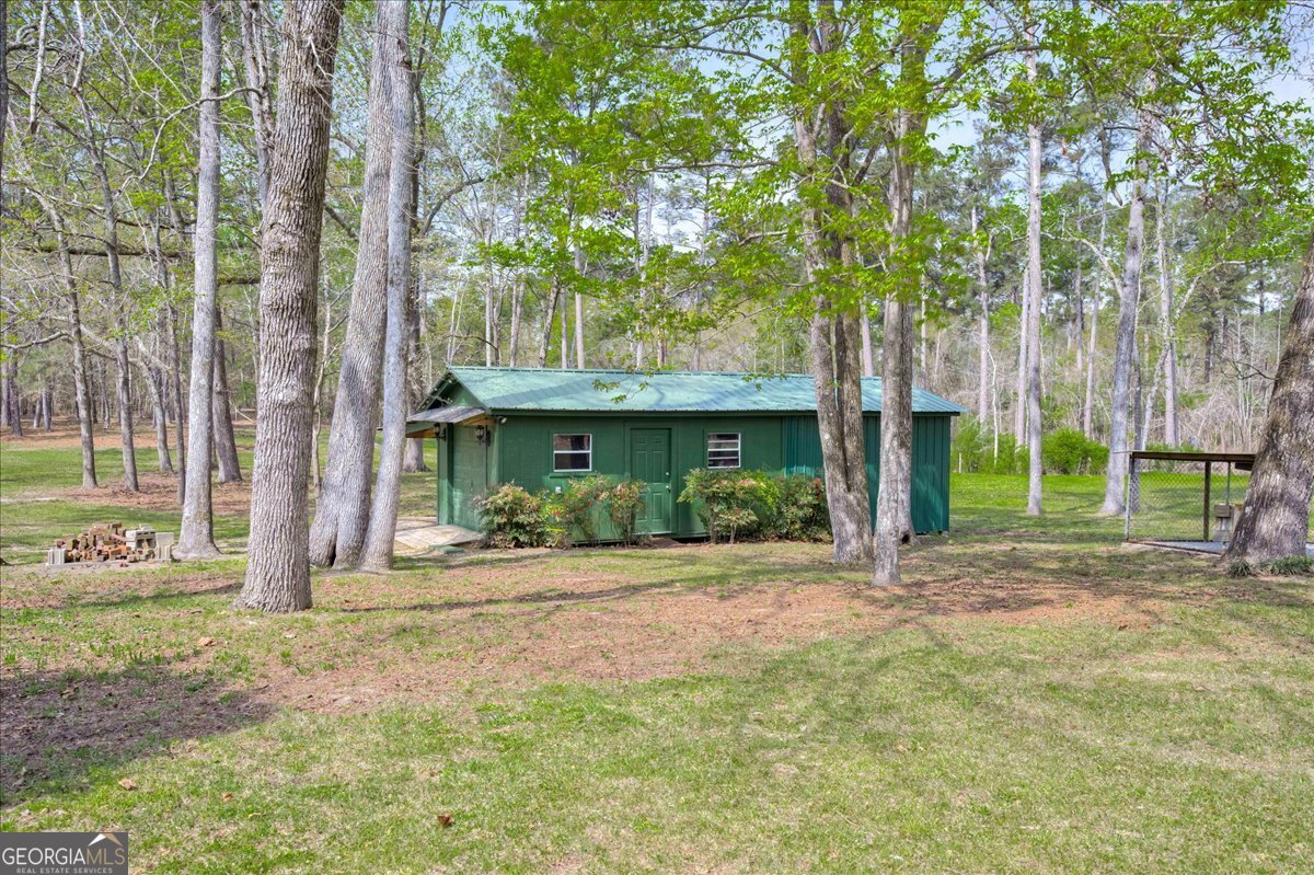 1490 Country Club Circle Wrens, GA 30833 - Photo 39 of 40 a view of a house with backyard and a tree