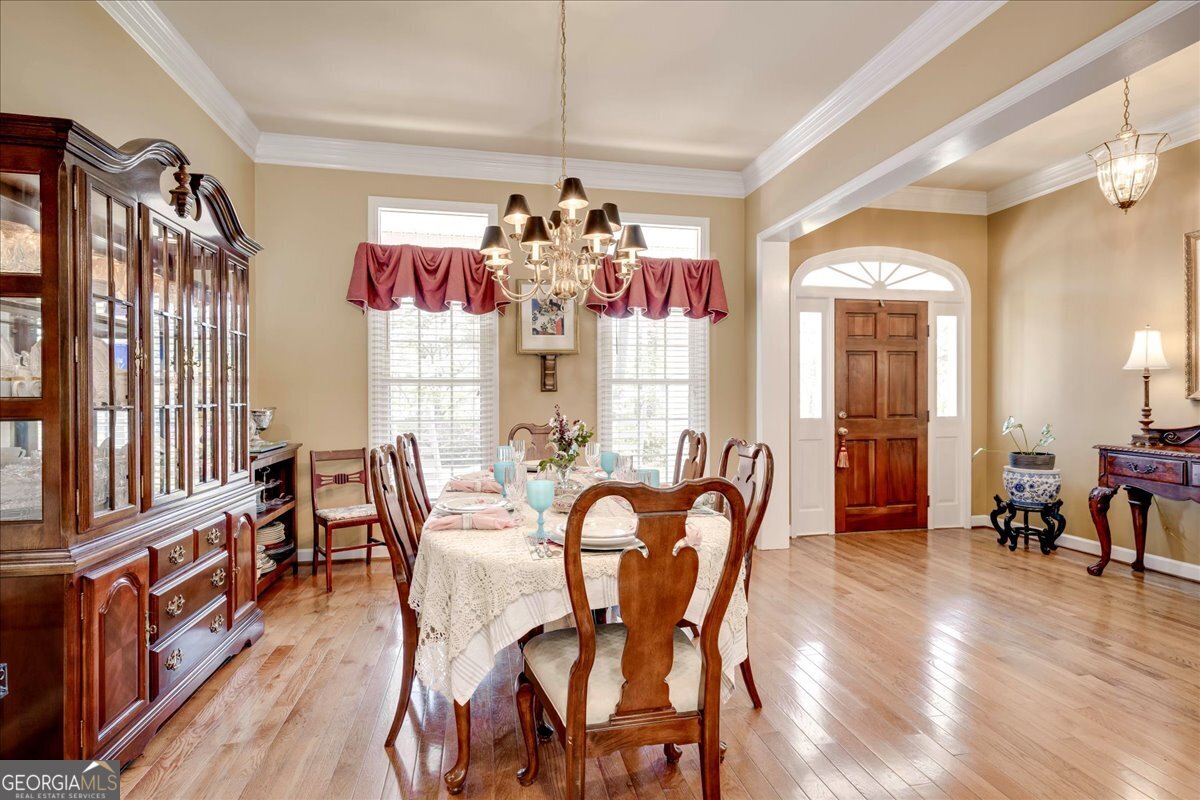 1490 Country Club Circle Wrens, GA 30833 - Photo 7 of 40 a view of a dining room with furniture window and wooden floor
