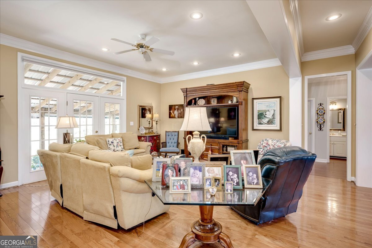 1490 Country Club Circle Wrens, GA 30833 - Photo 8 of 40 a living room with furniture or outdoor view and a large window