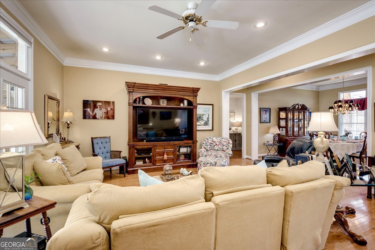 1490 Country Club Circle Wrens, GA 30833 - Photo 9 of 40 a living room with furniture and a flat screen tv