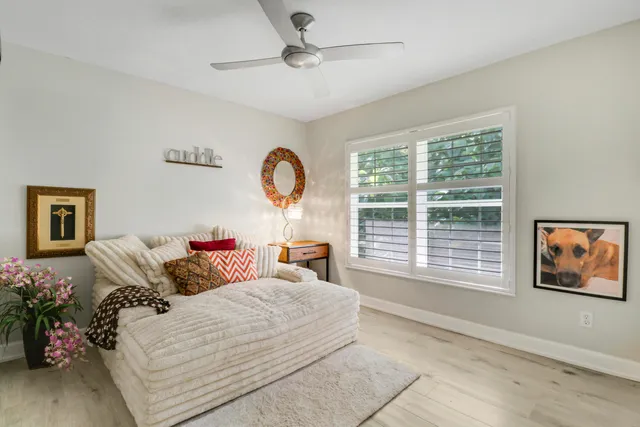 a house view with a sitting space garden and patio