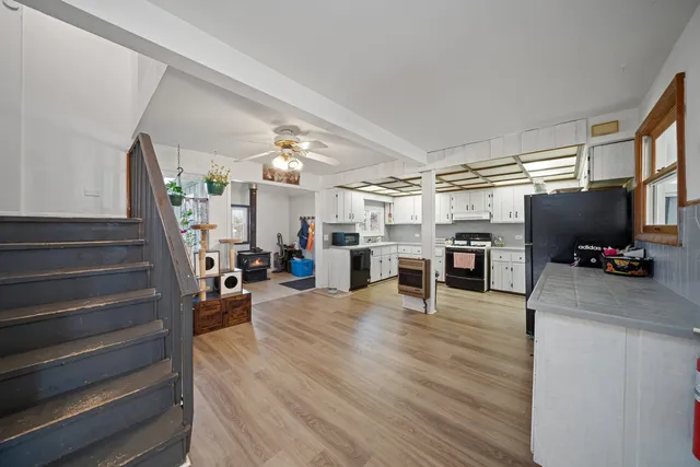 a view of a livingroom with furniture and a flat screen tv