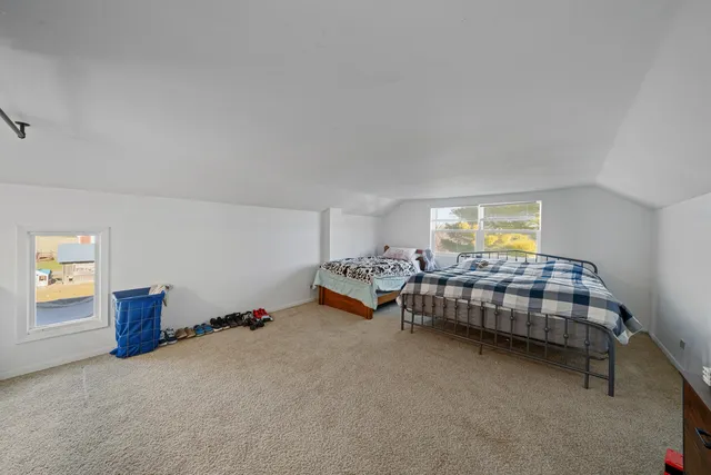 a bedroom with furniture and window
