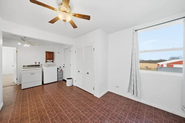a view of a kitchen with wooden floor and a sink