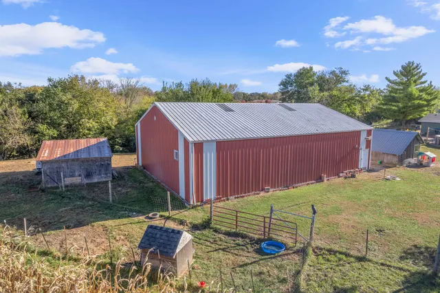 a view of a backyard with sitting area