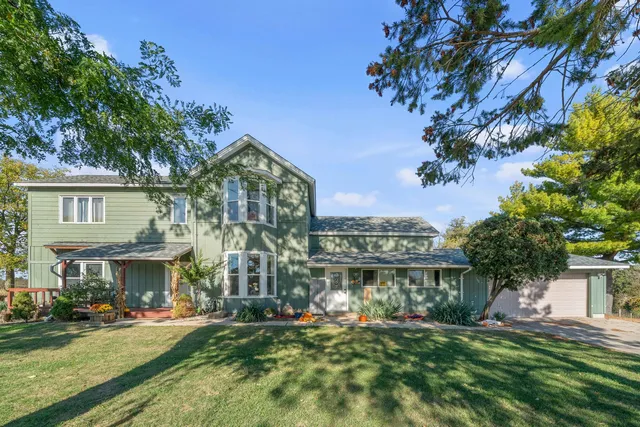 a front view of a residential apartment building with a yard