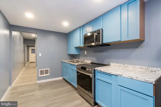 a kitchen with a stove and a microwave
