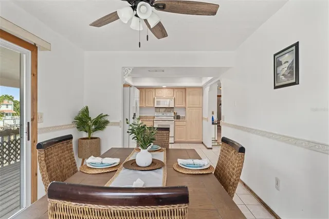 a dining room with furniture a rug and wooden floor