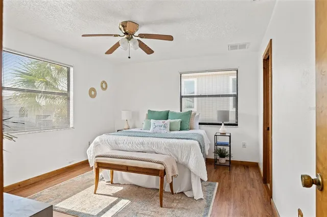 a bedroom with a bed and a table in it