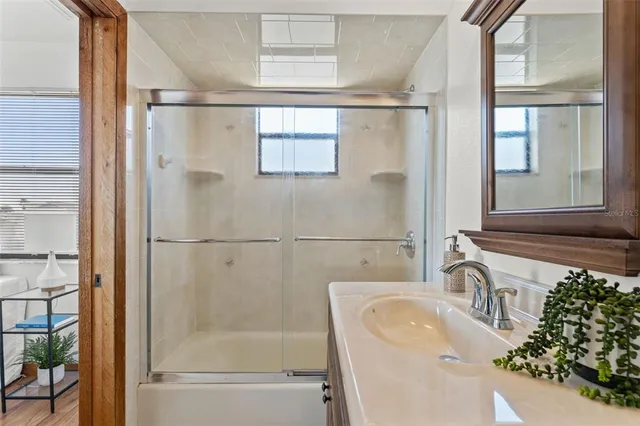 a bathroom with a sink and a shower