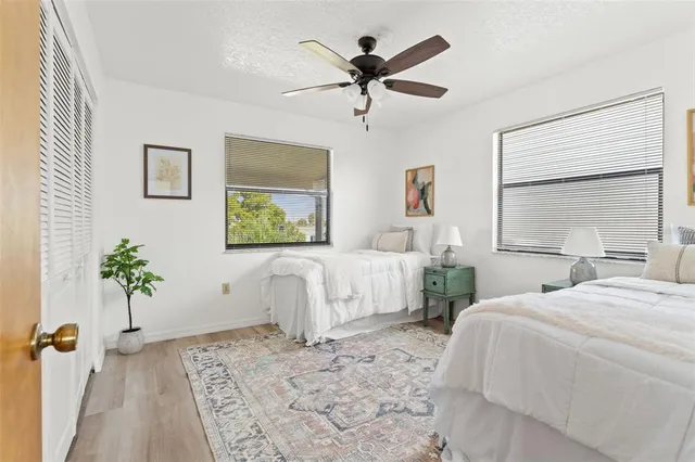 a bedroom with a large bed and a window