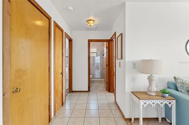 a view of an entryway with wooden floor