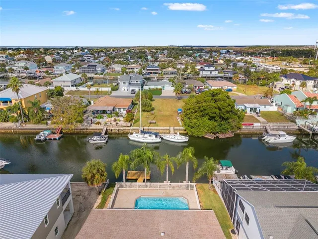 an aerial view of a house with a lake view