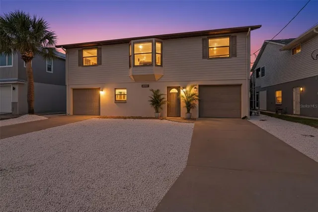 a front view of a house with yard