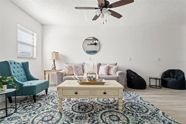 a living room with furniture and a rug