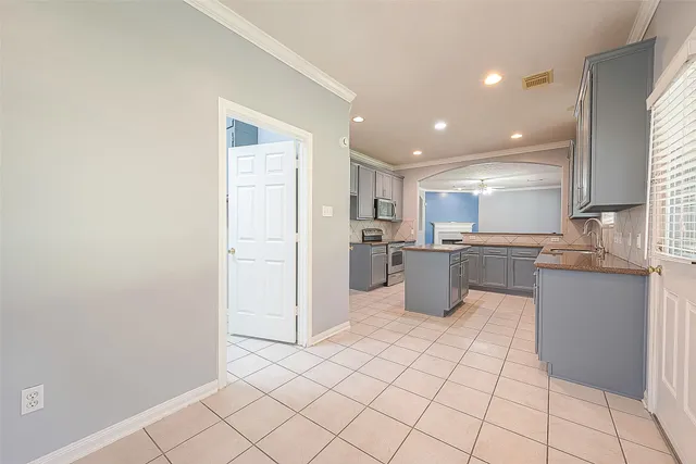 a kitchen with stainless steel appliances a refrigerator and a sink