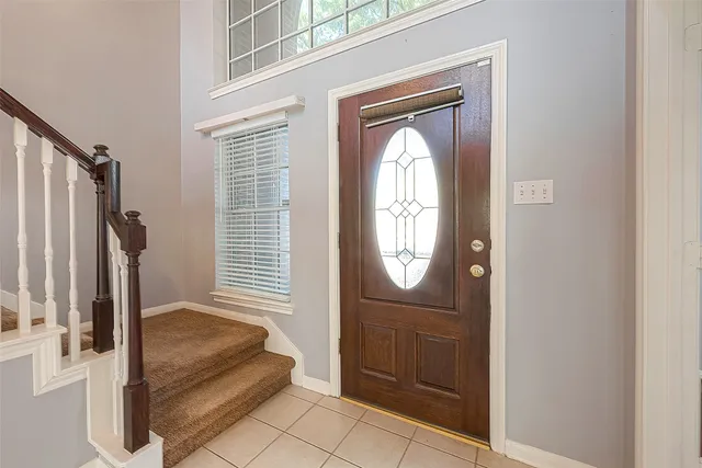 a view of a entryway door with wooden floor