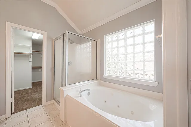 a bathroom with a bathtub and shower