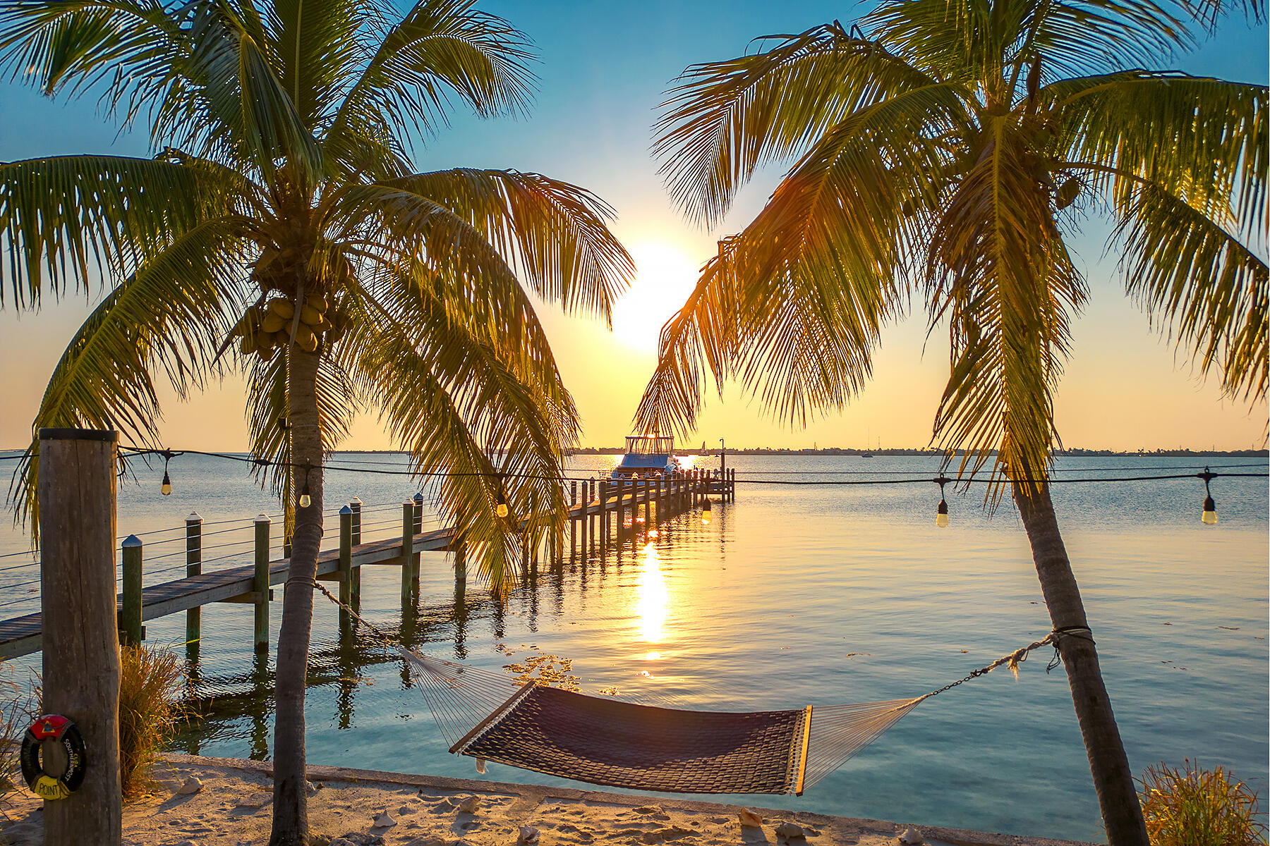 640 Elma Avenue Big Pine Key, FL 33043 - Photo 3 of 87 a view of a swimming pool with a table and chairs
