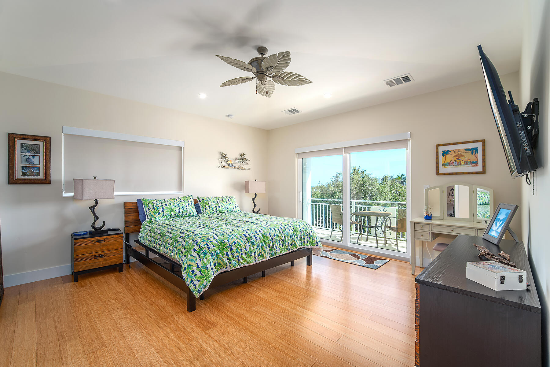 640 Elma Avenue Big Pine Key, FL 33043 - Photo 42 of 87 a bedroom with a bed a flat screen tv and a large window