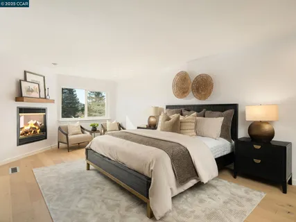 a bathroom with a granite countertop sink a mirror and a shower