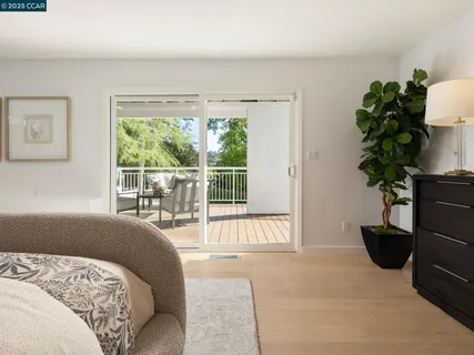 a view of a chairs and table in the balcony