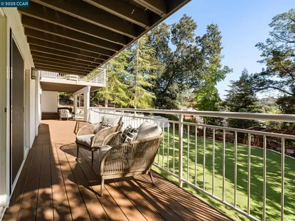 a view of a yard with large trees