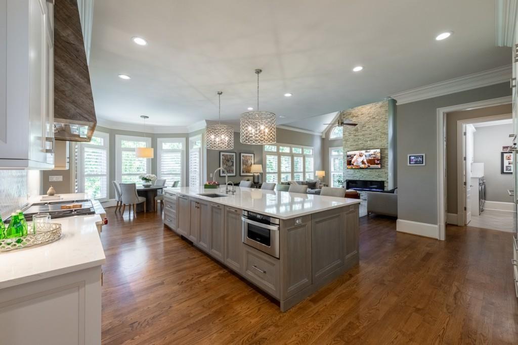 165 Autry Trail Alpharetta, GA 30022 - Photo 12 of 70 a large kitchen with stainless steel appliances granite countertop a large counter top and stove