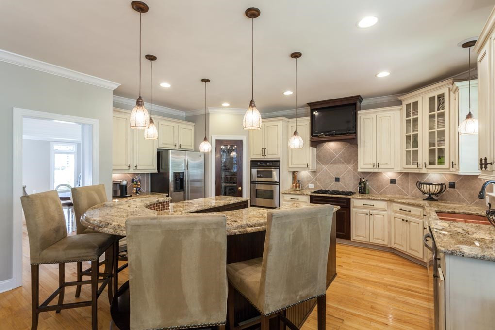 12340 Canolder Street Raleigh, NC 27614 - Photo 11 of 30 Additional features include granite counters, pendant lighting, under-cabinet lighting, recessed lighting, hardwood floors and a wine cooler. Stainless Appliances including Gas Cook Top
