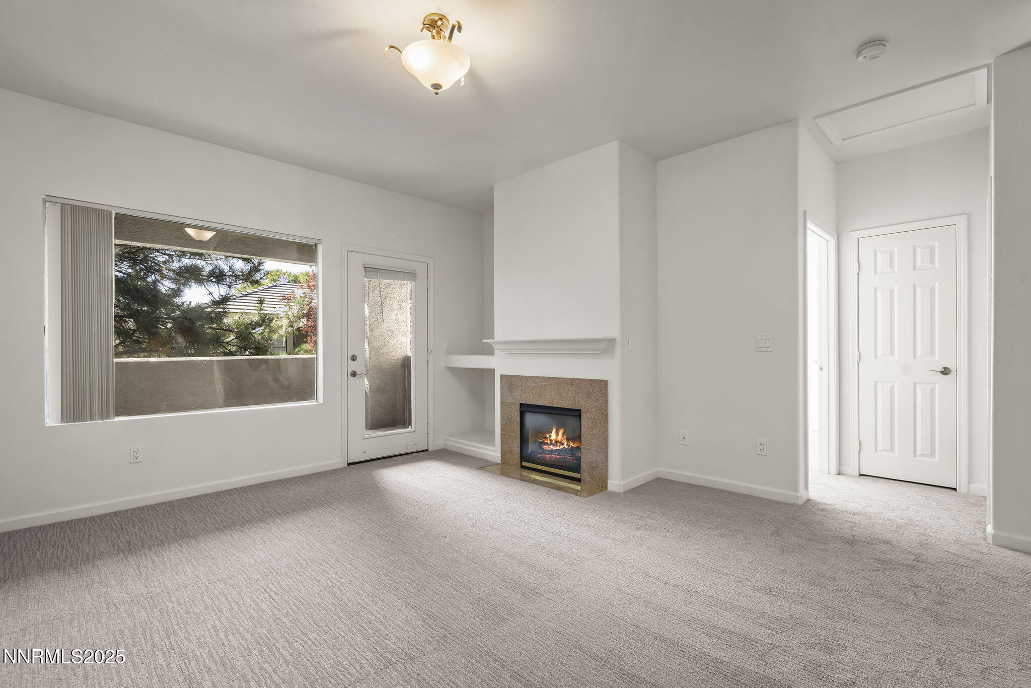 900 South Meadows Parkway, Unit 622 Reno, NV 89521 - Photo 4 of 30 a view of empty room with a fireplace