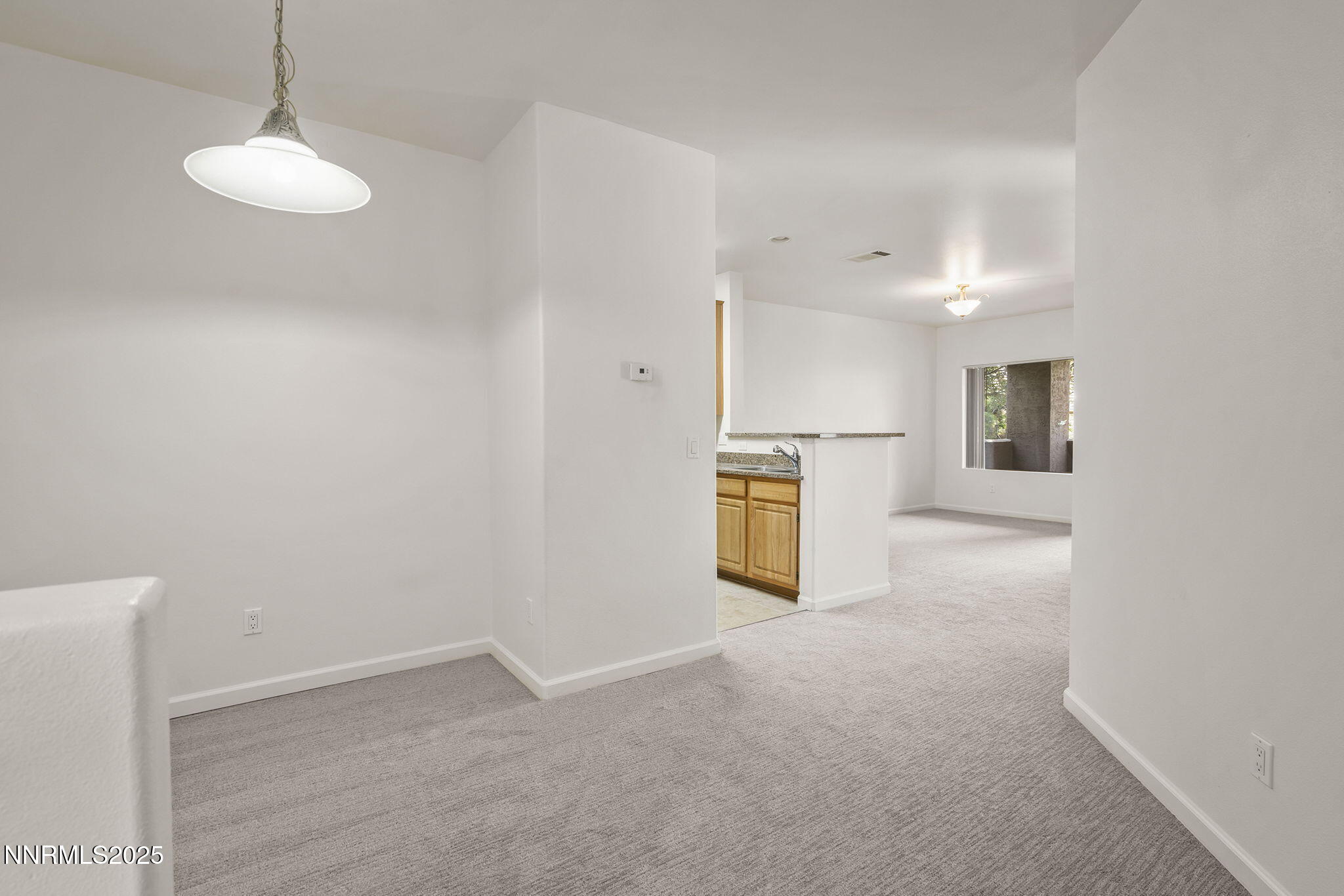 900 South Meadows Parkway, Unit 622 Reno, NV 89521 - Photo 9 of 30 a view of a kitchen with a sink and a refrigerator
