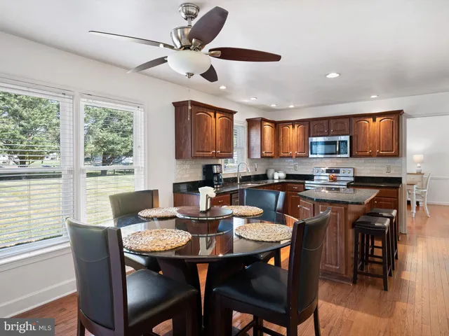 a view of a dining room with furniture window and outside view