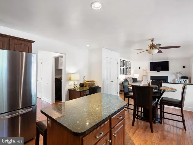 a kitchen with a table and chairs in it