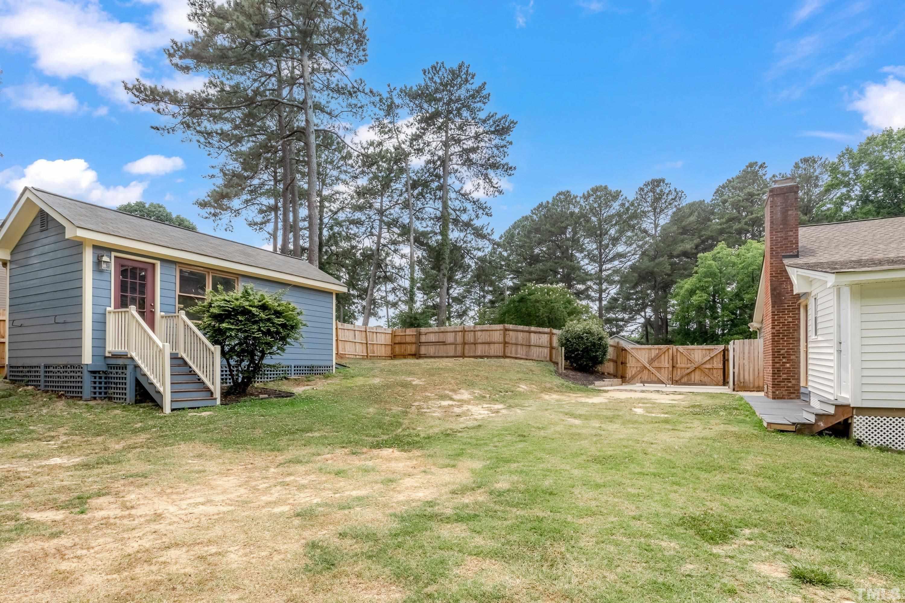 3108 Beane Drive Raleigh, NC 27604 - Photo 47 of 51 a view of a house with backyard and a tree