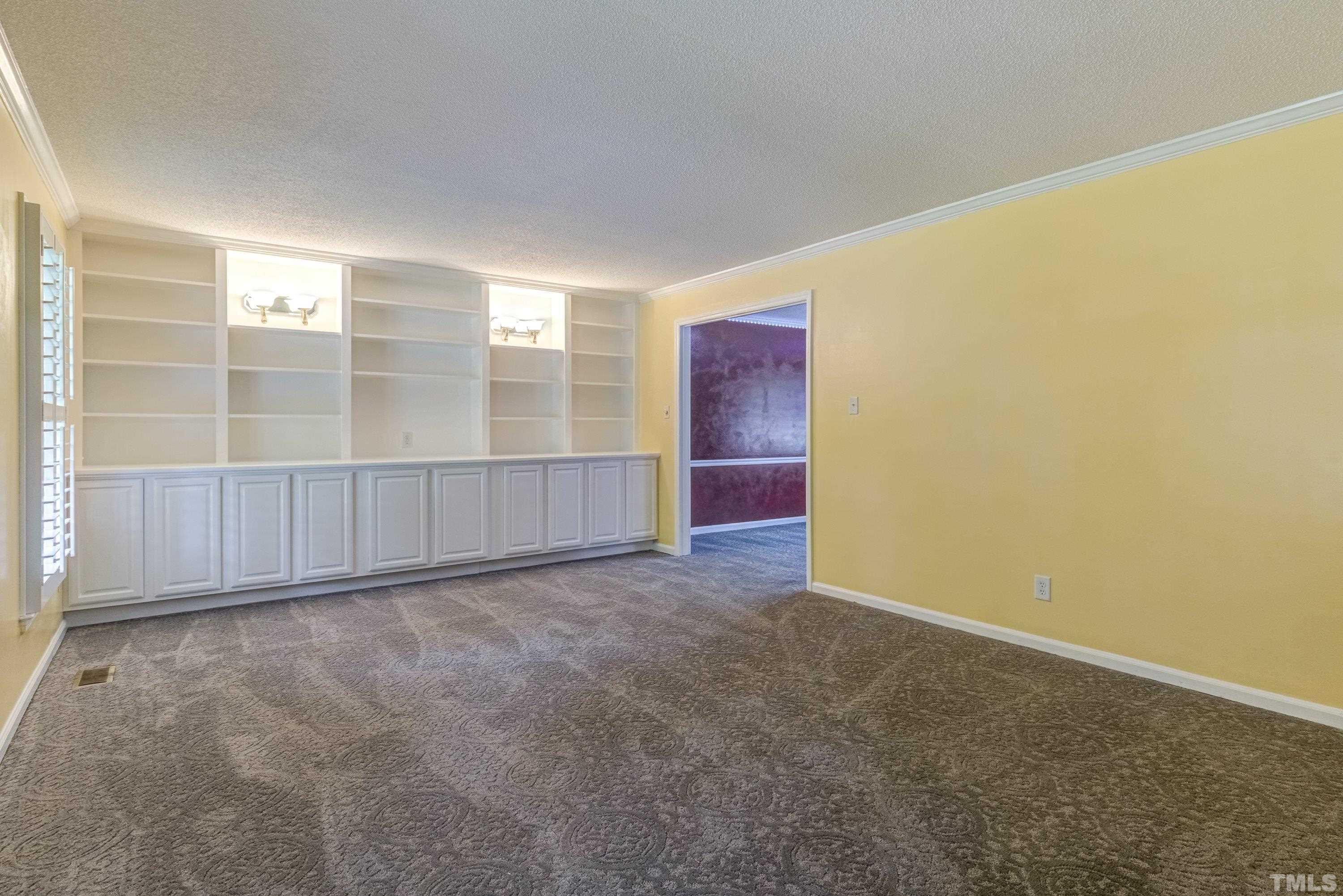3108 Beane Drive Raleigh, NC 27604 - Photo 8 of 51 an empty room with windows