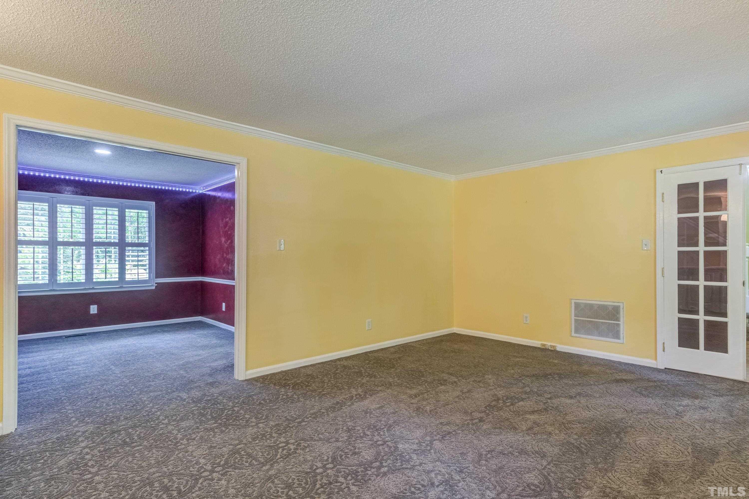 3108 Beane Drive Raleigh, NC 27604 - Photo 9 of 51 an empty room with windows