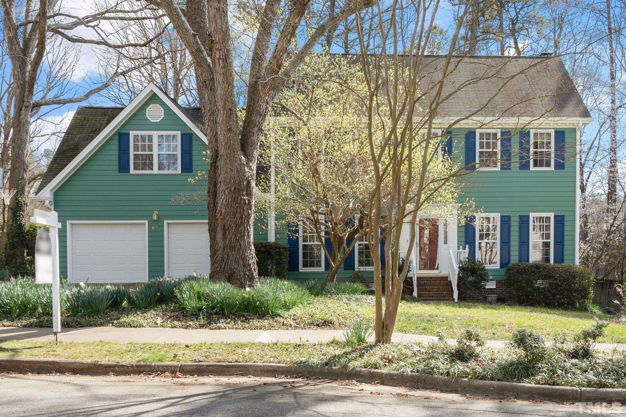 8612 Mourning Dove Road Raleigh, NC 27615 - Photo 1 of 29 a front view of a house with garden