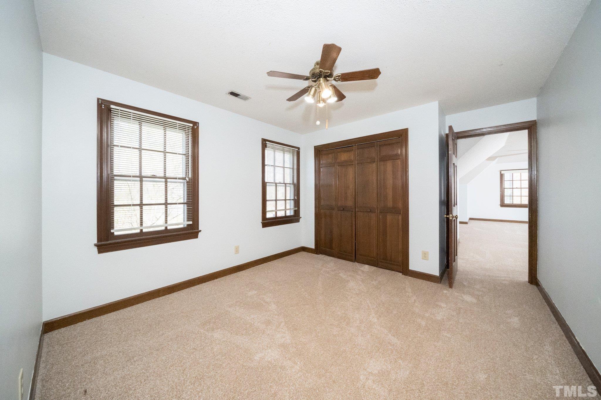 8612 Mourning Dove Road Raleigh, NC 27615 - Photo 21 of 29 a view of an empty room with a window