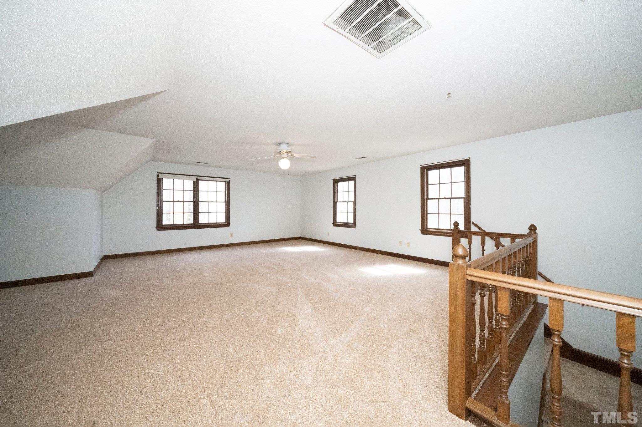8612 Mourning Dove Road Raleigh, NC 27615 - Photo 23 of 29 a view of an empty room with windows