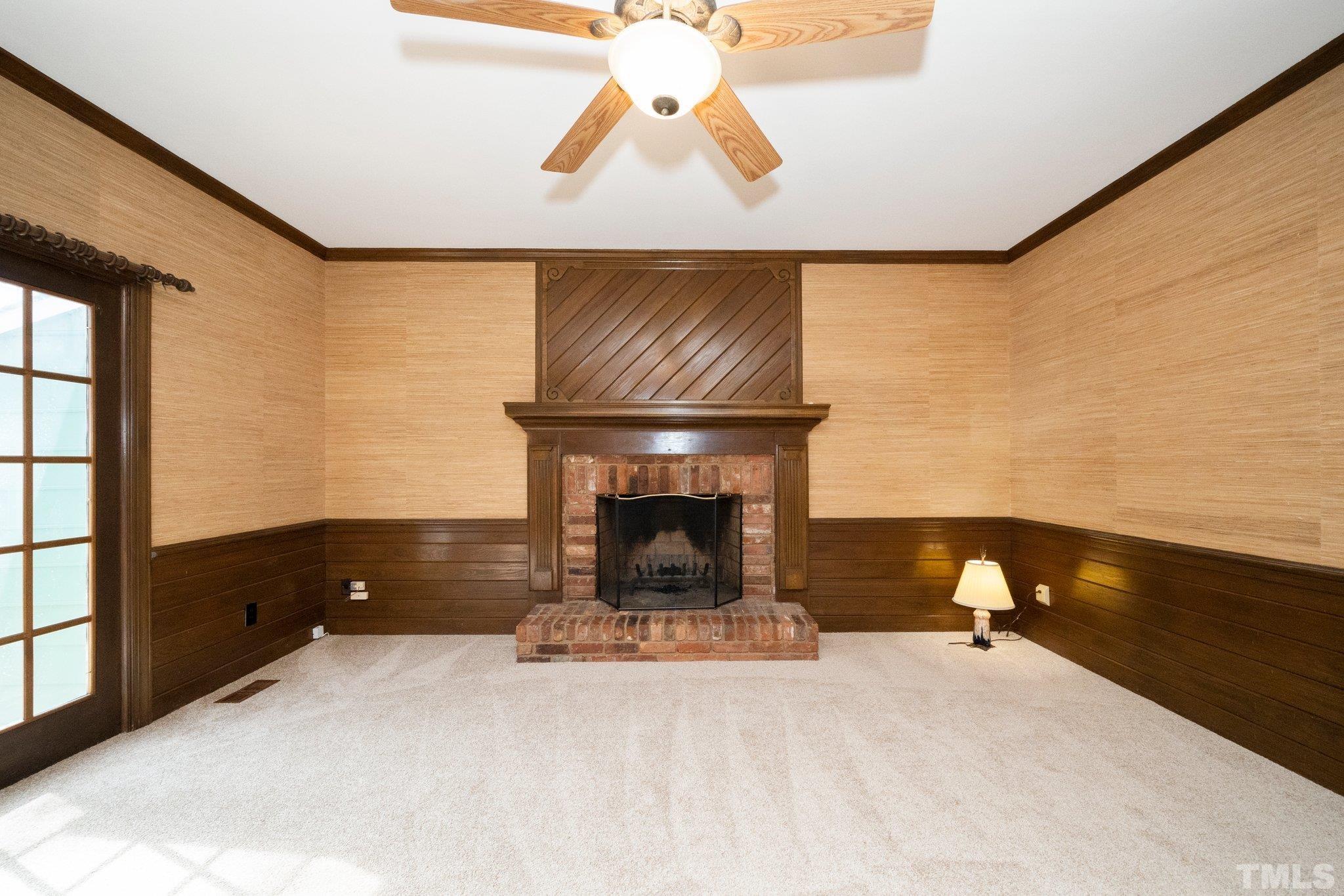8612 Mourning Dove Road Raleigh, NC 27615 - Photo 8 of 29 a living room with furniture and a fireplace