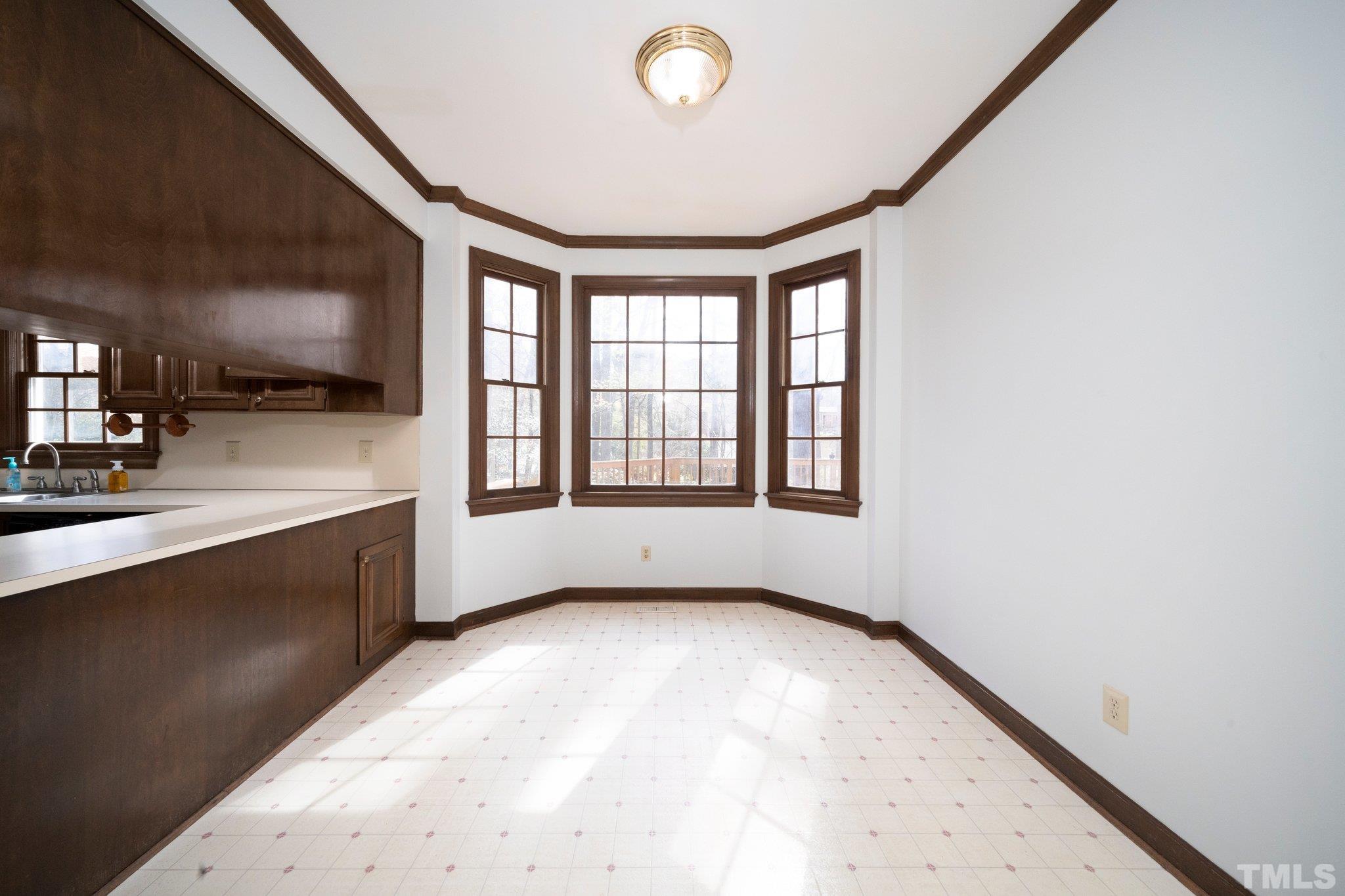 8612 Mourning Dove Road Raleigh, NC 27615 - Photo 10 of 29 a view of an empty room with a window