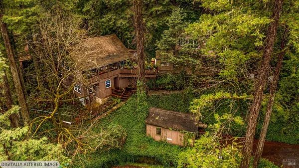an aerial view of a house with a garden
