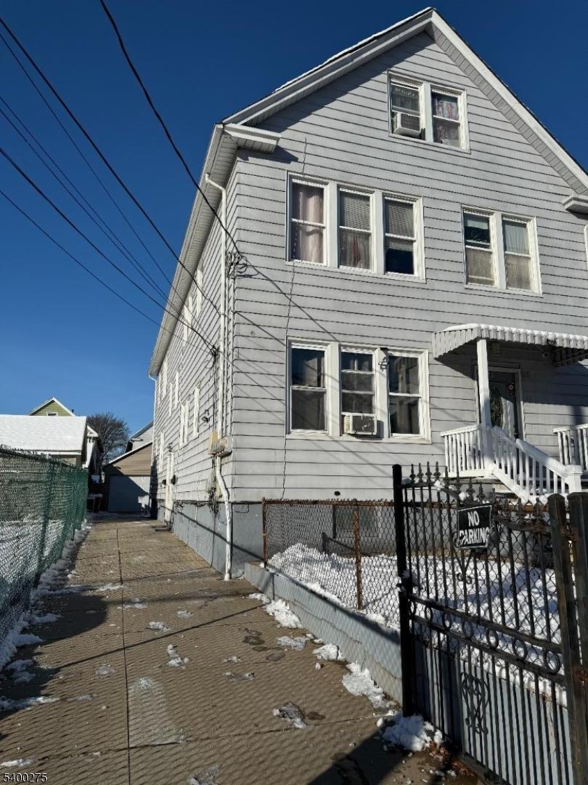 1010 Kilsyth Road Elizabeth, NJ 07208 - Photo 2 of 9 a front view of a house with parking