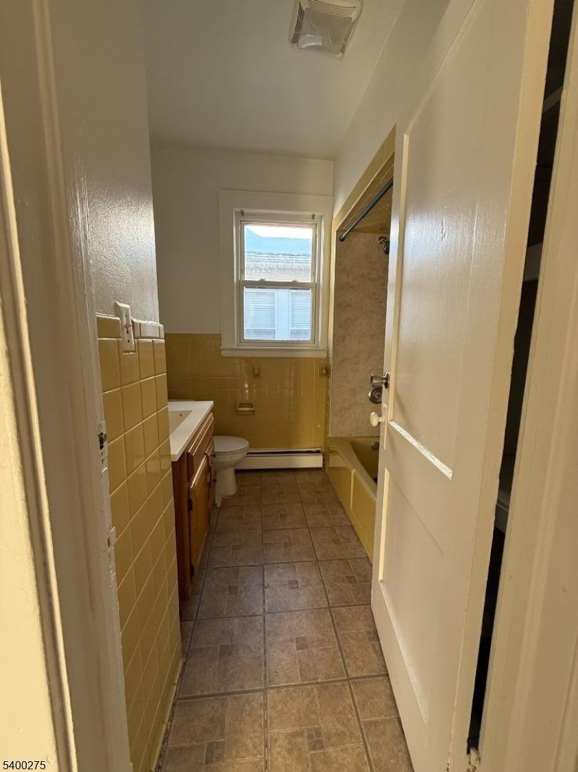 1010 Kilsyth Road Elizabeth, NJ 07208 - Photo 7 of 9 a bathroom with a sink toilet and shower